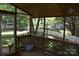 Covered porch offering views of a well-maintained yard, perfect for relaxing outdoors at 10434 Blackstock Rd, Huntersville, NC 28078