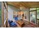 Screened-in porch with wood-paneled ceilings, cozy seating, and views of the backyard at 10434 Blackstock Rd, Huntersville, NC 28078