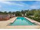 A large swimming pool and lounging area surrounded by lush greenery in a community setting at 10434 Blackstock Rd, Huntersville, NC 28078