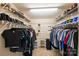 Spacious walk-in closet with ample shelving and hanging space for clothing and shoe storage at 10434 Blackstock Rd, Huntersville, NC 28078