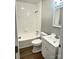Well-lit bathroom with white tile, a shower-tub combo, and updated vanity for a clean aesthetic at 1052 S Grove Street Ext, Lincolnton, NC 28092