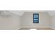 Minimalist bedroom with hardwood floors, a large window, and a modern air conditioning unit at 1141 Harper Lee Dr, Newton, NC 28658