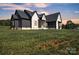 Well maintained two story home with a lush green lawn in a quiet neighborhood at 1141 Harper Lee Dr, Newton, NC 28658