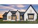 Beautiful two story home with modern black trim accents and professionally landscaped yard at 1141 Harper Lee Dr, Newton, NC 28658
