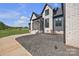 Landscaped front yard with well-manicured flowerbeds and mature trees leading to the home's entrance at 1141 Harper Lee Dr, Newton, NC 28658