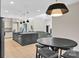 An open-concept kitchen with an island and bar stool seating connects to a cozy living space at 1141 Harper Lee Dr, Newton, NC 28658
