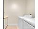 Bright laundry room with a white washer and dryer, and a small counter at 1141 Harper Lee Dr, Newton, NC 28658