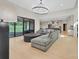 Spacious living room with abundant natural light, modern décor, and seamless flow to the kitchen at 1141 Harper Lee Dr, Newton, NC 28658