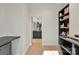 A glimpse into the kitchen and backyard through the pantry at 1141 Harper Lee Dr, Newton, NC 28658