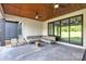 Inviting outdoor patio with comfortable seating, ceiling fans, and a view of the backyard at 1141 Harper Lee Dr, Newton, NC 28658