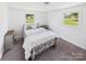 Cozy bedroom featuring a well-dressed bed, neutral walls, and carpet flooring, creating a comfortable resting space at 120 Hepler Rd, Taylorsville, NC 28681