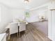 Dining room area with a view of an entry door to the backyard and living room at 120 Hepler Rd, Taylorsville, NC 28681
