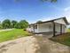 Home featuring a covered carport, leading to a back entry door at 120 Hepler Rd, Taylorsville, NC 28681