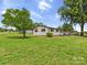 Home with vinyl siding, a cozy front yard, and mature tree at 120 Hepler Rd, Taylorsville, NC 28681