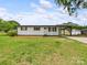 Charming single-story home featuring a covered carport and well-maintained lawn at 120 Hepler Rd, Taylorsville, NC 28681