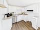 Bright kitchen featuring stainless steel appliances, white cabinetry, and granite countertops at 120 Hepler Rd, Taylorsville, NC 28681