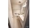 Accessible bathroom with grab bars, single sink vanity, and white tiled floors at 13416 Four Oaks Ln, Matthews, NC 28105
