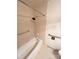 Bathroom with grab bars, tiled tub, and accessible features at 13416 Four Oaks Ln, Matthews, NC 28105