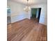 Traditional dining room with hardwood floors and classic chandelier at 13416 Four Oaks Ln, Matthews, NC 28105