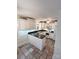 Charming kitchen with white cabinets, granite countertops, modern appliances, and tiled floors at 13416 Four Oaks Ln, Matthews, NC 28105