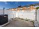 Fenced patio area with concrete slab and white rock landscaping at 1348 Green Oaks Ln # L, Charlotte, NC 28205