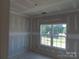Bright bedroom with a window, offering a cozy space awaiting personalized finishing touches at 145 Mason Tanner Ct, Rock Hill, SC 29730