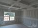 Bright bedroom featuring neutral-colored walls and ceilings and a large window, awaiting finishing touches at 145 Mason Tanner Ct, Rock Hill, SC 29730
