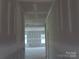 Bright hallway featuring neutral walls and ceilings, leading to an open room with natural light at 145 Mason Tanner Ct, Rock Hill, SC 29730