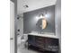Bathroom with walk-in tub and dark wood vanity with marble countertop at 15333 Catawba S Cir, Matthews, NC 28104