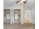 Bedroom with custom closet organizer systems featuring drawers, shelves, and wardrobe storage at 15333 Catawba S Cir, Matthews, NC 28104