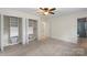 Bedroom includes closet with shelving, and adjacent bathroom at 15333 Catawba S Cir, Matthews, NC 28104