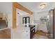 Modern kitchen with white cabinets, stainless steel appliances, quartz countertops and hardwood floors at 15333 Catawba S Cir, Matthews, NC 28104