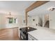 Bright living room with hardwood floors, modern lighting and quartz topped bar overlooking the kitchen at 15333 Catawba S Cir, Matthews, NC 28104