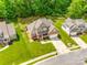 Stunning aerial view of a meticulously landscaped home featuring a well-manicured lawn and inviting front porch at 1655 Essex Hall Dr, Rock Hill, SC 29730