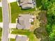 Aerial view of a house with a well-maintained backyard, a deck, and a cozy fire pit at 1655 Essex Hall Dr, Rock Hill, SC 29730