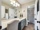 Well-lit bathroom featuring double sinks, neutral walls, and a separate toilet for added privacy at 1655 Essex Hall Dr, Rock Hill, SC 29730
