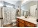 Well-lit bathroom features a decorative shower curtain, modern vanity, and neutral decor at 1655 Essex Hall Dr, Rock Hill, SC 29730