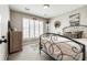 Bedroom featuring modern minimalist decor, large window and hardwood floors at 1655 Essex Hall Dr, Rock Hill, SC 29730