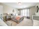 This bedroom features modern decor, a window, and neutral carpeting at 1655 Essex Hall Dr, Rock Hill, SC 29730