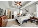 This bedroom offers a tray ceiling, plush carpet, and large windows providing ample natural light at 1655 Essex Hall Dr, Rock Hill, SC 29730