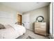 This bedroom has natural light, and a modern dresser for ample storage at 1655 Essex Hall Dr, Rock Hill, SC 29730
