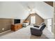 Cozy bedroom with a vaulted ceiling, plush carpeting, and a comfortable sitting area at 1655 Essex Hall Dr, Rock Hill, SC 29730