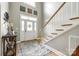 Bright foyer with soaring ceilings, staircase with wood treads, and stylish decor at 1655 Essex Hall Dr, Rock Hill, SC 29730