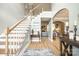 Elegant foyer showcasing hardwood floors, staircase, and open layout to other living areas at 1655 Essex Hall Dr, Rock Hill, SC 29730