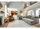 Open-concept living room with fireplace, comfortable seating, and views into the kitchen and dining area at 1655 Essex Hall Dr, Rock Hill, SC 29730