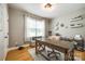 Comfortable home office with a wooden desk, chair, and natural light from the window at 1655 Essex Hall Dr, Rock Hill, SC 29730
