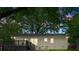 This brick home features a rear wooden deck and patio area, perfect for outdoor entertaining at 1700 Emerywood Dr, Charlotte, NC 28210