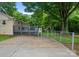 Large backyard with privacy fence, storage shed and wooden deck with access to the home at 1700 Emerywood Dr, Charlotte, NC 28210