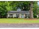 Charming home featuring a tidy front yard, classic brick facade and a inviting front door at 1700 Emerywood Dr, Charlotte, NC 28210