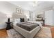 Bright and spacious main bedroom showcasing large bed, rug, and lots of natural light at 1700 Emerywood Dr, Charlotte, NC 28210